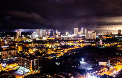 High angle view of illuminated city buildings at night