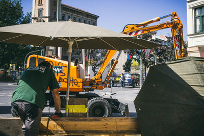 Man working at construction site in city