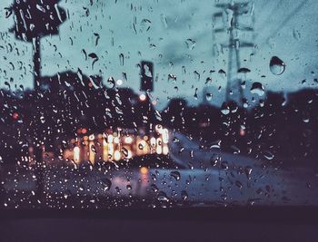 Raindrops on glass window during rainy season