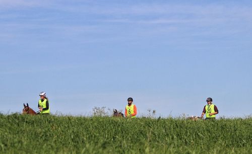 People on field against sky