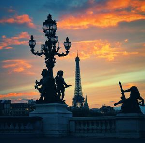 Low angle view of statue against cloudy sky