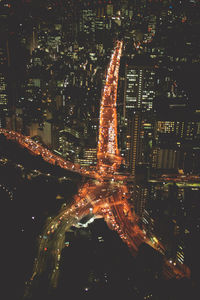 Aerial view of illuminated buildings in city at night