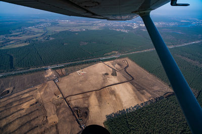 Aerial view of landscape seen through airplane window