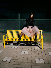 Rear view of man sitting on chair
