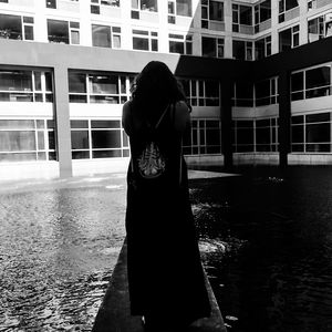 Woman standing in front of building