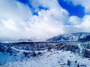 Scenic view of snow covered mountains