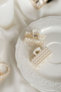 Close-up of wedding rings on table