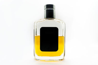 Close-up of bottle against white background