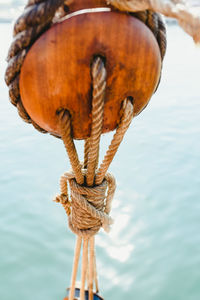 Close-up of rope tied on wooden post