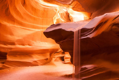 Sand flowing from rock at upper antelope canyon navajo tribal park arizona