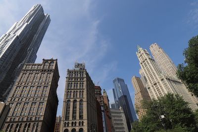 Low angle view of buildings in city against sky