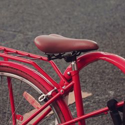 Cropped image of person riding bicycle on street