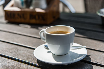 Close-up of coffee cup on table