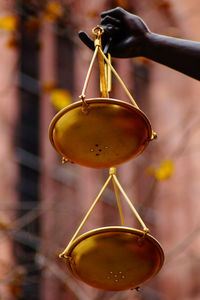 Close-up of light bulb hanging on metal