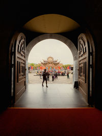 People walking in tunnel