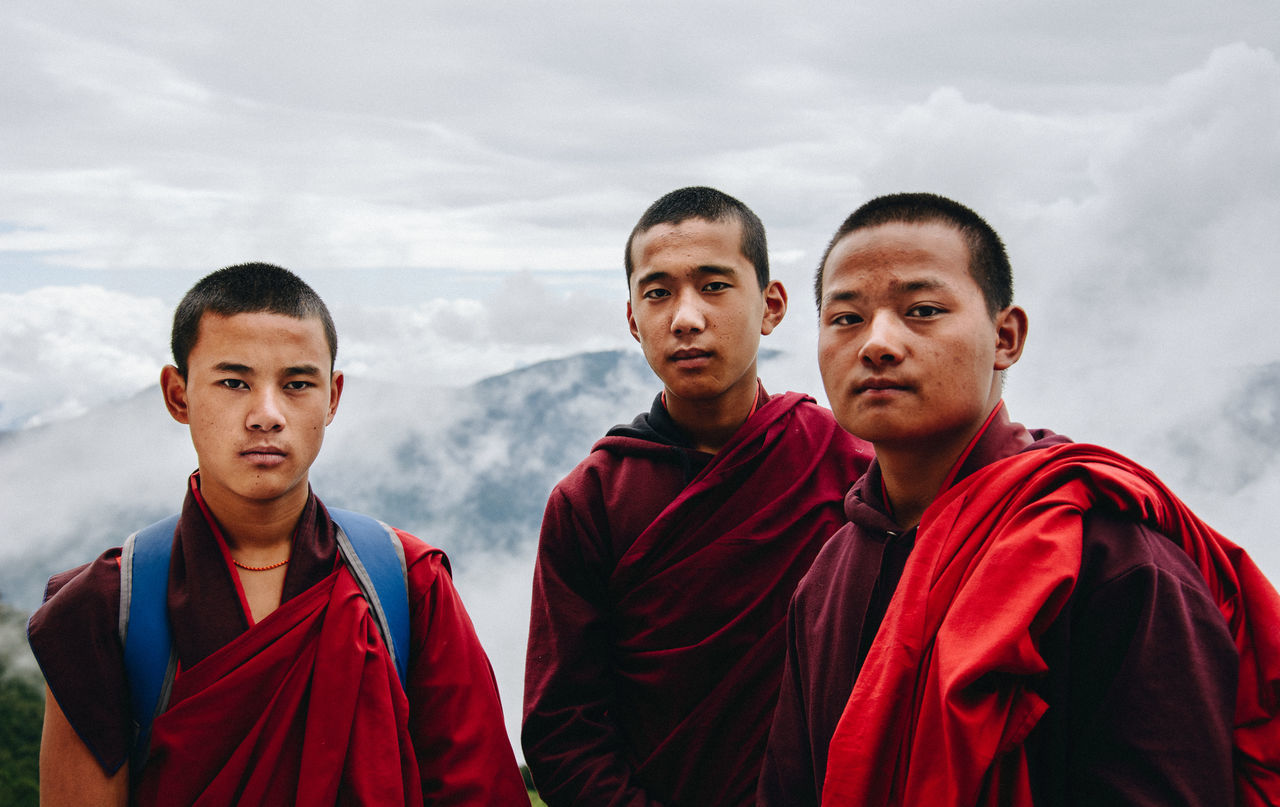 looking at camera, group of people, sky, young adult, portrait, cloud - sky, standing, young men, clothing, people, men, nature, togetherness, front view, males, day, real people, teenager, outdoors, adolescence