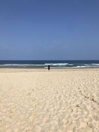 Scenic view of beach against clear sky