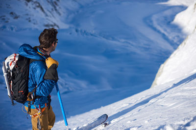 Skier stood still looking at mer de glace glacier