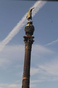 Low angle view of bell tower against sky