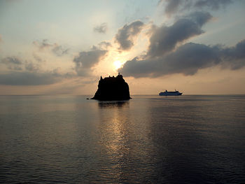 Scenic view of sea against cloudy sky