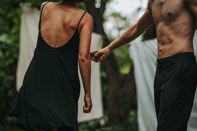 Rear view of couple standing outdoors