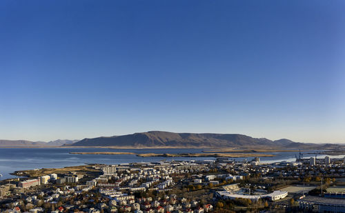 Contemporary coastal town under blue sky