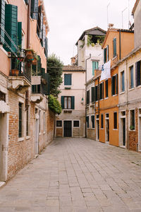 Footpath amidst buildings in town