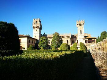 Low angle view of historic building against blue sky