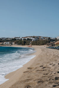 Scenic view of beach against clear sky