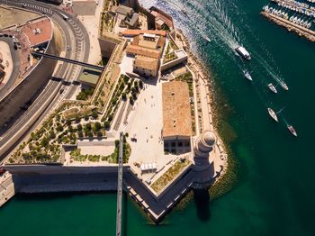 Aerial view of buildings by sea