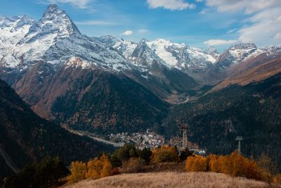 Scenic view of snowcapped mountains against sky