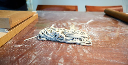 Close-up of cutting board on table