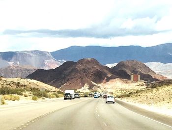 Country road leading towards mountains