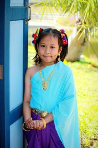 Portrait of smiling girl standing outdoors