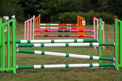 Row of empty chairs in field