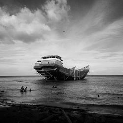 Abandoned ship at sea against sky