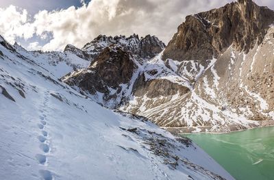 Scenic view of snowcapped mountains against sky