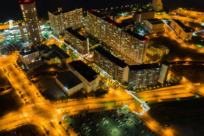 High angle view of illuminated buildings in city at night