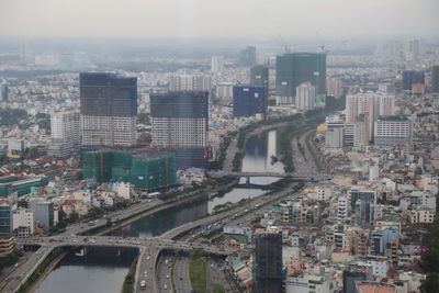 High angle view of buildings in city against sky