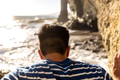 Rear view of man at beach