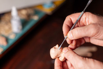 Close-up of hand holding pen