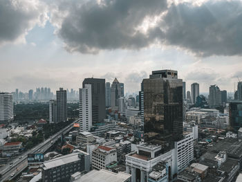 High angle view of modern buildings in city against sky