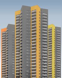 Low angle view of buildings against sky in city