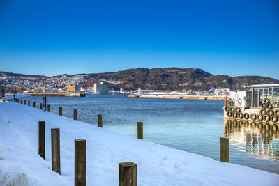 Scenic view of frozen sea against clear blue sky