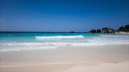 View of beach against blue sky