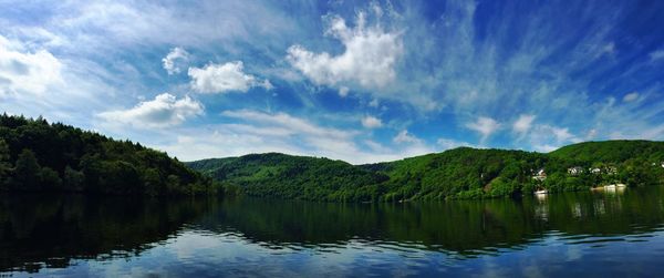 Scenic view of lake with mountains in background
