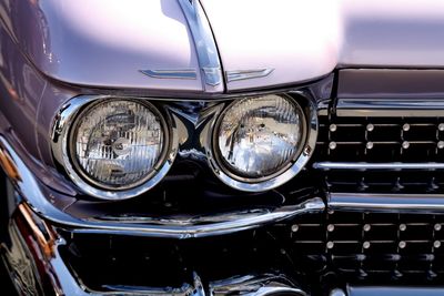 Close-up of car on road