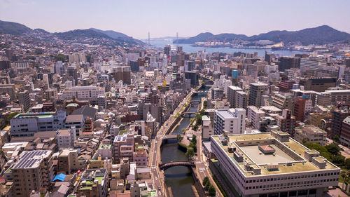 Aerial view of cityscape against sky