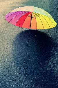 High angle view of raindrops on road