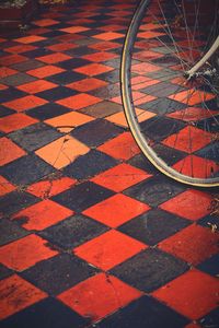 High angle view of bicycle parked on tiled floor